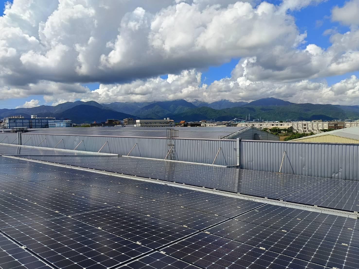 Factory Solar Panel Array - Distant Mountain View
